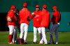 Washington Nationals third base coach Bob Henley, center, speaks with players during a baseball workout, Friday, Oct. 18, 2019, in Washington, in advance of the team's appearance in the World Series. (AP Photo/Patrick Semansky)