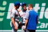 New York Mets right fielder Michael Conforto, center, speaks with manager Mickey Callaway, left, and a member of the Mets staff after colliding with second baseman Robinson Cano as they failed to catch a fly ball that was hit by Washington Nationals' Howie Kendrick in the fifth inning of a baseball game, Thursday, May 16, 2019, in Washington. Conforto left the game after the play. (AP Photo/Patrick Semansky)