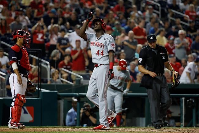 Cincinnati Reds' Aristides Aquino celebrates his two-run homer during the eighth inning of a baseball game against the Washington Nationals at Nationals Park, Monday, Aug. 12, 2019, in Washington. The Nationals won 7-6. (AP Photo/Alex Brandon)