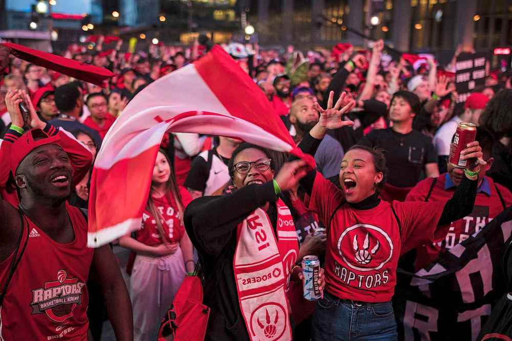 THE CANADIAN PRESS/ Tijana Martin
Toronto Raptors fans outside the Scotiabank Arena at Jurassic Park during the NBA finals against the Golden State Warriors in Toronto on Thursday. The NBA attracts the kind of young fans that leaves sponsors and advertisers drooling and other leagues green with envy.
