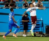 Mexico's Jesus Gallardo (23) moves the ball against Martinique's Romario Barthelery (22) during the first half of their CONCACAF Golf Cup soccer match in Charlotte, N.C., Sunday, June 23, 2019. (AP Photo/Chuck Burton)