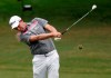 Webb Simpson hits a fairway shot on the second hole during the final round of the Wyndham Championship golf tournament at Sedgefield Country Club in Greensboro, N.C., Sunday, Aug. 4, 2019. (AP Photo/Chris Seward)