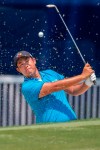 Byeong Hun An, of South Korea, hits from a sand trap on the 18th hole during the first round of the Wyndham Championship golf tournament in Greensboro, N.C., Thursday, Aug. 1, 2019. (H. Scott Hoffmann/News & Record)