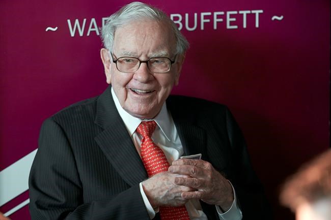 Warren Buffett, Chairman and CEO of Berkshire Hathaway, smiles as he plays bridge following the annual Berkshire Hathaway shareholders meeting in Omaha, Neb., Sunday, May 5, 2019. (AP Photo/Nati Harnik)