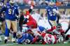 John Woods / The Canadian Press
Calgary Stampeders' Rob Cote (26) gets in on the tackle of Winnipeg Blue Bombers' Andrew Harris (33) during the first half of CFL action in Winnipeg Thursday.