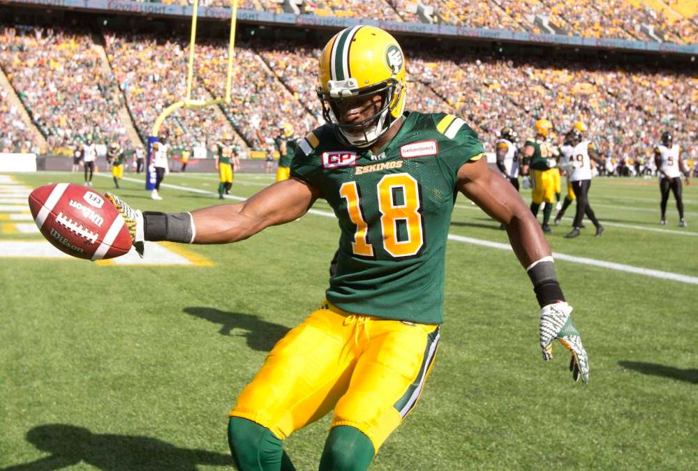 Jason Franson / The Canadian Press
Edmonton Eskimos Cory Watson (18) celebrates a touchdown against the Hamilton Tiger-Cats during first half CFL action in Edmonton, Alta., on Saturday July 23, 2016.