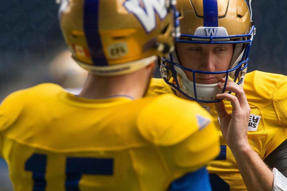 MIKE DEAL / WINNIPEG FREE PRESS
Winnipeg Blue Bombers’ new starting QB Matt Nichols (15) and QB Drew Willy (5) during practice at IGF on Sunday.