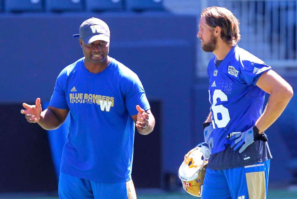 BORIS MINKEVICH / WINNIPEG FREE PRESS
Defensive backs coach Tony Missick talks to Taylor Loffler during practice Monday at Investors Group Field.