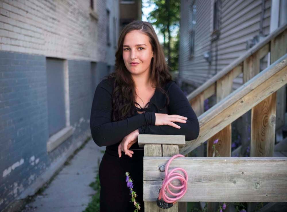 ZACHARY PRONG / WINNIPEG FREE PRESS
Sarah Arksey stands at the spot where bike was stolen, her lock still dangling from a post. Arksey's missing bike poster went viral on social media.