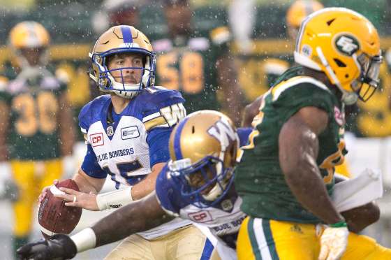 Jason Franson / The Canadian PressWinnipeg Blue Bombers quarterback Matt Nichols looks through the rain for an open receiver Thursday night against the Eskimos during first-half CFL action in Edmonton.