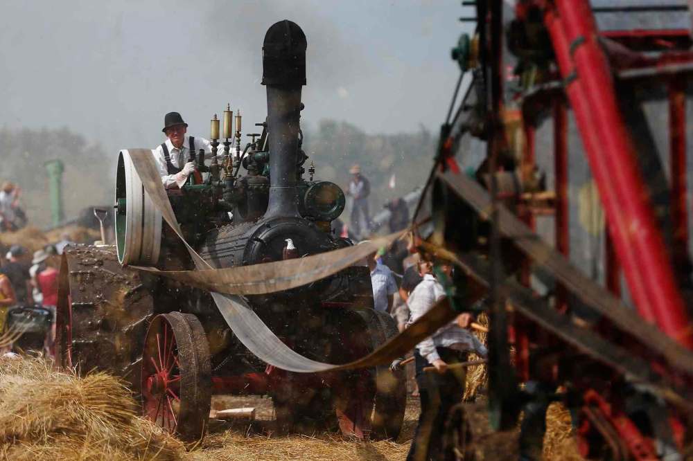 JOHN WOODS / WINNIPEG FREE PRESS About 150 antique threshing machines at the Manitoba Agricultural Museumand the Canadian Foodgrains Bank attempt to break a Guinness World Record for the most antique threshing machine to harvest a field in 16 minutes Sunday, July 31, 2016.