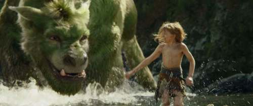 DISNEY
Pete (Oakes Fegley) frolics with his furry dragon friend Elliot.