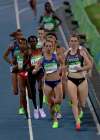 Canada's Nicole Sifuentes, right, and United States' Shannon Rowbury, center, competes in a women's 1500-meter heat during the athletics competitions of the 2016 Summer Olympics at the Olympic stadium in Rio de Janeiro, Brazil, Friday, Aug. 12, 2016. (AP Photo/Martin Meissner)