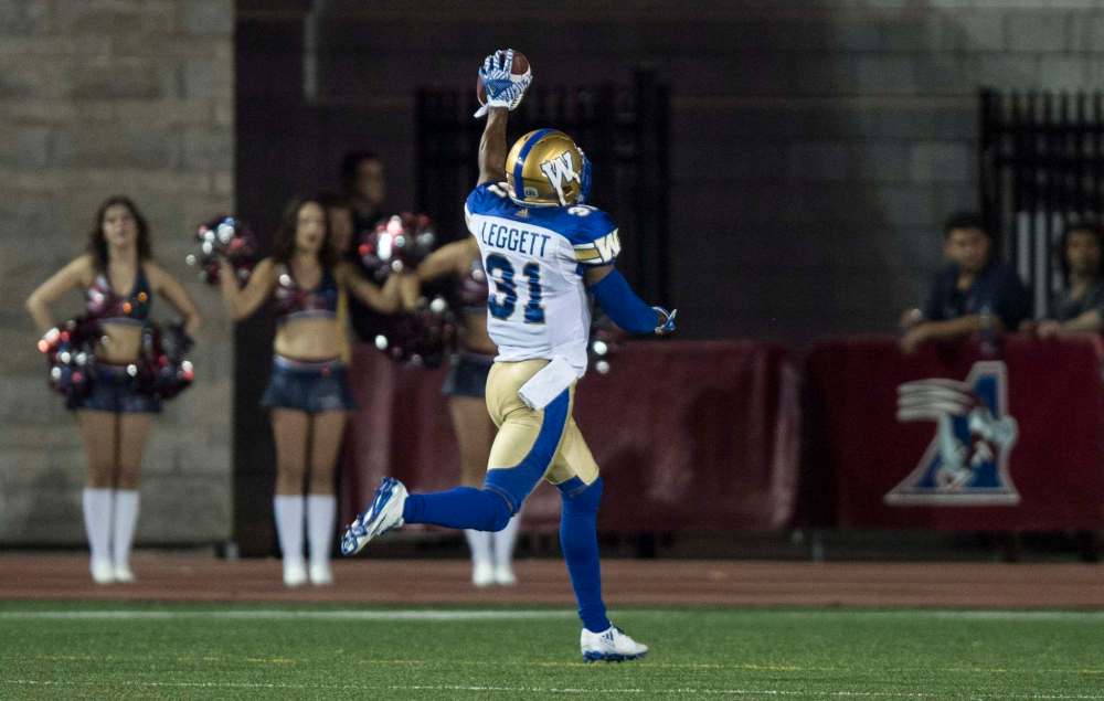 photos by Paul Chiasson / The Canadian Press
Bombers DB Maurice Leggett celebrates his touchdown on an interception of Alouettes QB Kevin Glenn Friday. With his third pick-6 of the season he tied the franchise record set in 1963 by ‘Tricky Dick’ Thornton.