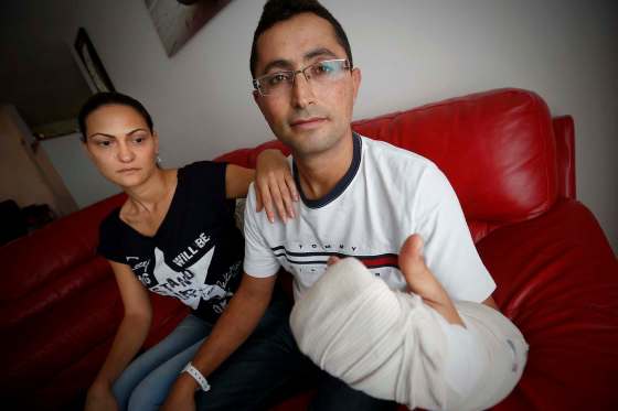 JOHN WOODS / WINNIPEG FREE PRESSTalia Gohari and her husband Shayke, recent newcomers to Winnipeg, show the injuries they received as they were robbed at knifepoint and slashed last Thursday when they took a break outside an entry to Canada transition program.