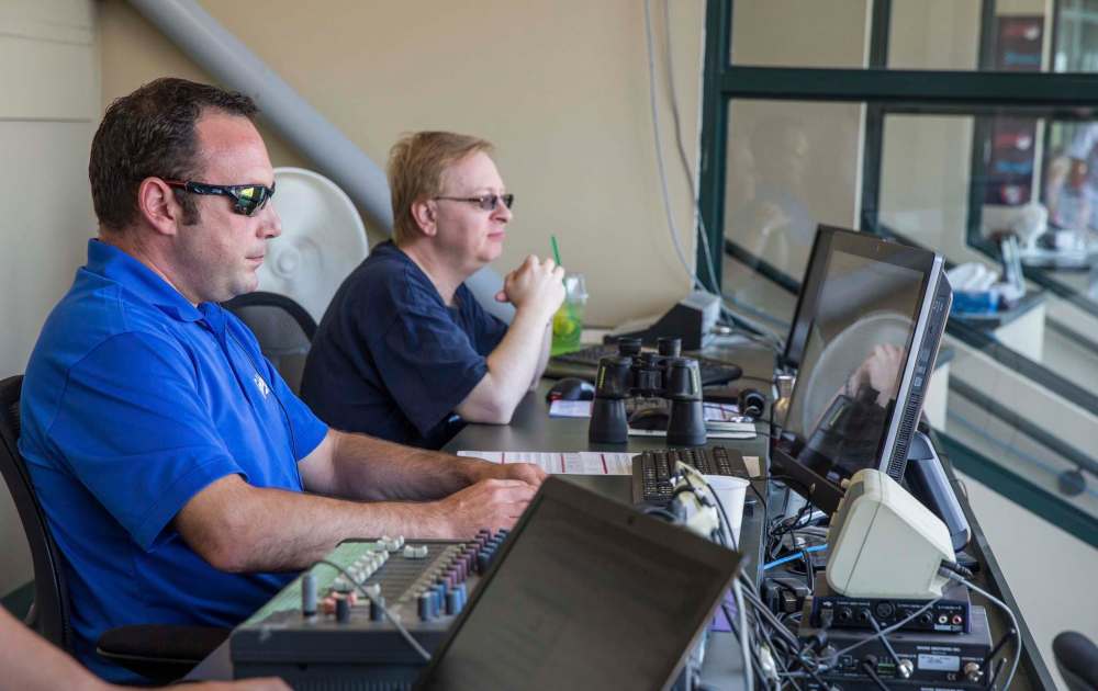 MIKE DEAL / WINNIPEG FREE PRESS
Regan Katz (left) is assistant GM and scoreboard operator and Steve Eitzen is the official scorekeeper.