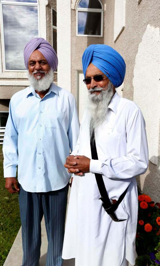WAYNE GLOWACKI / WINNIPEG FREE PRESSAt right, Harpal Gill was refused entry into the Dollarama on Jefferson Avenue Thursday because he was wearing his ceremonial Sikh kirpan. He was with his neighbour Joginder Sidhu (left), who was also wearing his kirpan when they were barred at the door.