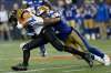 JOHN WOODS / THE CANADIAN PRESS FILES
Hamilton Tiger-Cats' Andy Fantuz (83) is stopped by Winnipeg Blue Bombers' Khalil Bass (2) during second half CFL action in Winnipeg Wednesday, August 3, 2016.