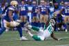 JOHN WOODS / THE CANADIAN PRESS
Saskatchewan Roughriders' Naaman Roosevelt (82) hauls in the pass in front of Winnipeg Blue Bombers' Tony Burnett (26) during first half CFL Banjo Bowl action.