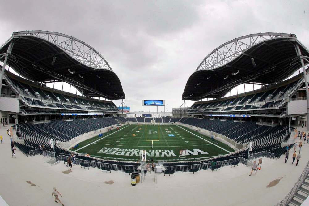 JOHN WOODS / THE CANADIAN PRESS
Janelle-Marie Emond took her nine-year-old son to his first ever football game, but was met with rude fans after her son sported a green sweatshirt over his Bombers T-shirt, she says.
