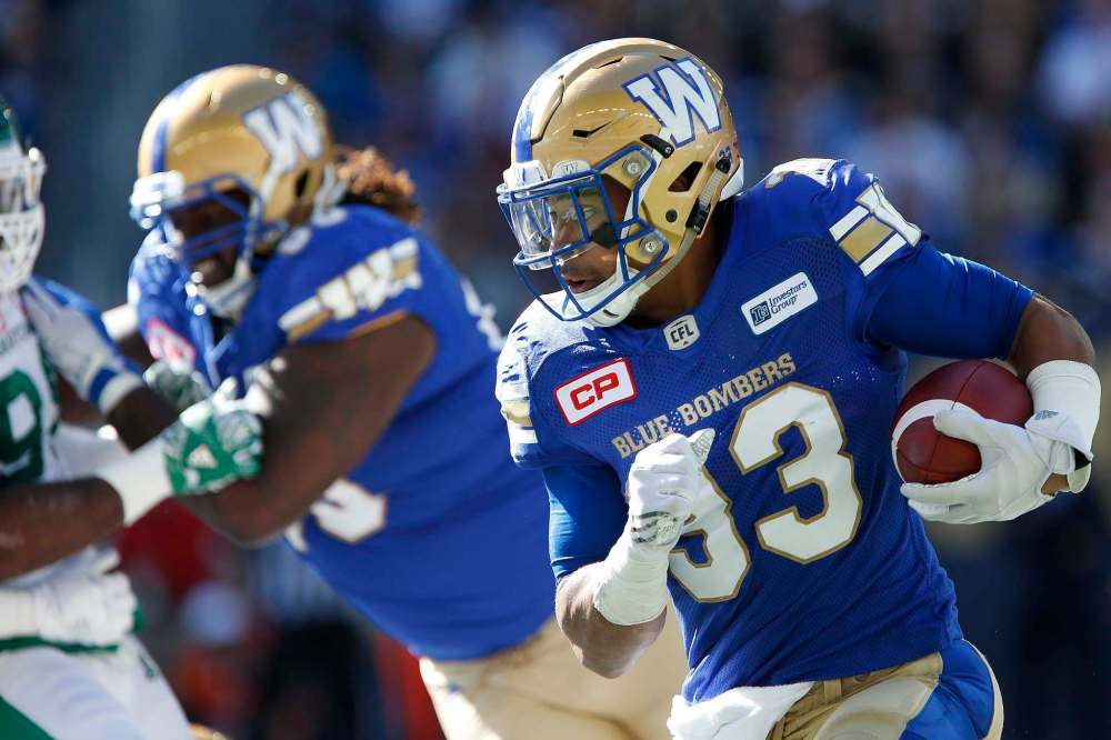 JOHN WOODS / THE CANADIAN PRESS FILES
Winnipeg Blue Bombers' Andrew Harris (33) runs against the Saskatchewan Roughriders during first half CFL Banjo Bowl Saturday.