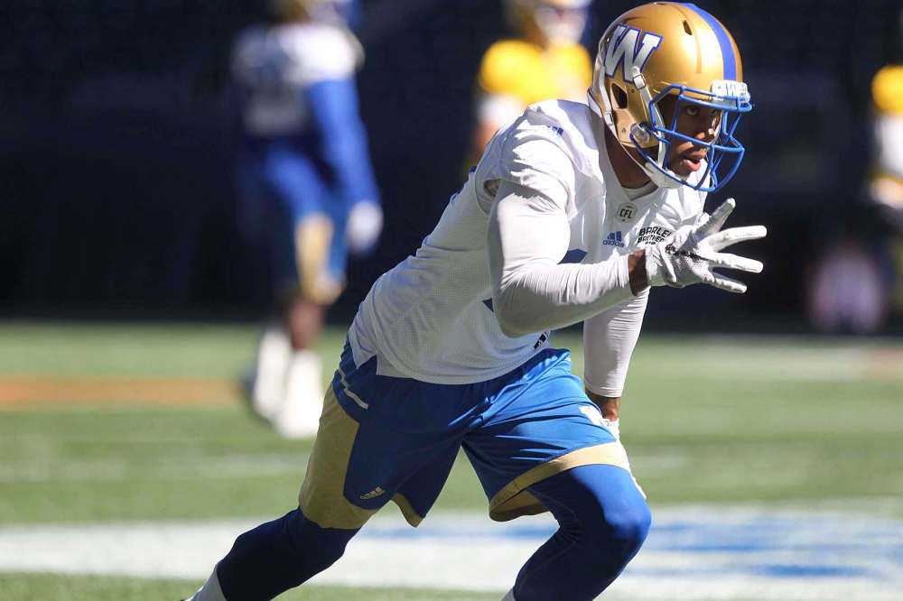 RUTH BONNEVILLE / WINNIPEG FREE PRESS
Bombers receiver Thomas Mayo doesn’t let a little thing such as not starting get in the way of his pre-game warmup.