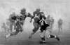 CANADIAN PRESS FILES
Leo Lewis (29) runs the ball as Hamilton Tiger Cats John Barrow (61) and Tim Reid (24) go in for the tackle during the Grey Cup final in Toronto, on Dec. 1, 1962. Winnipeg edged Hamilton 28-27 in the Fog Bowl at Toronto's Exhibition Stadium.