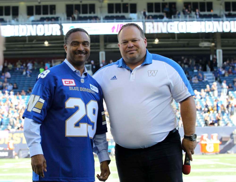 RUTH BONNEVILLE / WINNIPEG FREE PRESS
Leo Lewis III and Winnipeg Blue Bombers CEO Wade Miller at midfield during the halftime ceremony Saturday afternoon at Investors Group Field.