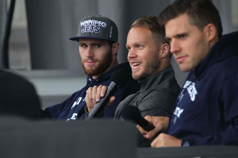 RUTH BONNEVILLE / WINNIPEG FREE PRESS
Jets players from left - Quinton Howden, Toby Enstrom and Ben Chiarot are interviewed at Jets FanFest outside IcePlex Saturday just before ice time.