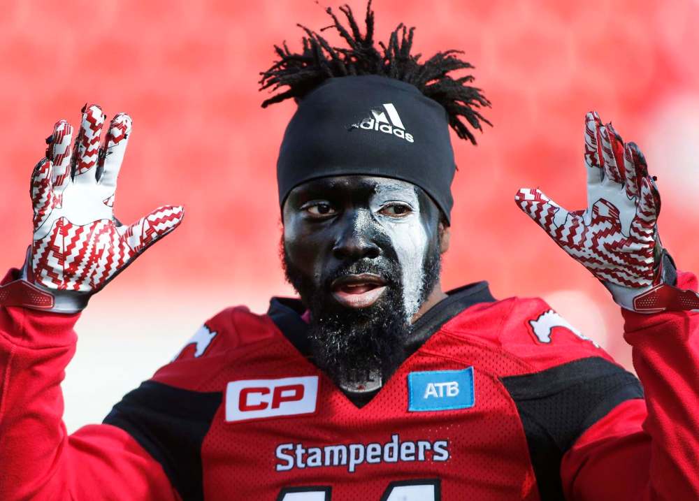 LARRY MACDOUGAL / THE CANADIAN PRESS
Stampeders' Joshua Bell shows off his face paint prior to the game against the Bombers in Calgary.