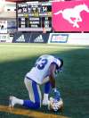 Winnipeg Blue Bombers' Kevin Fogg kneels in dejection after the Winnipeg Blue Bombers lost to the Calgary Stampeders by a last game play field goal during CFL football action, in Calgary on Saturday, Sept. 24, 2016. THE CANADIAN PRESS/Larry MacDougal