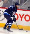 BORIS MINKEVICH / WINNIPEG FREE PRESS
Winnipeg Jets Julian Melchiori plays against the Calgary Flames Tuesday night at the MTS Centre.