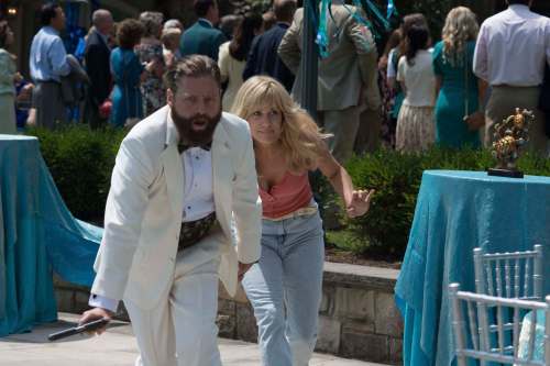 GLEN WILSON / ARMORED CAR PRODUCTIONS
Aw-shucks naif David Ghantt (Zach Galifianakis) and sassy co-worker (Kristen Wiig) star in the comedy Masterminds, a small and strange film based on a true heist story.