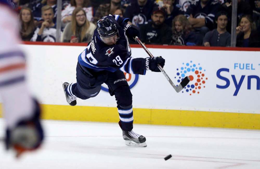 Trevor Hagan / The Canadian Press
Winnipeg Jets rookie Patrik Laine unloads a slapshot against the Edmonton Oilers Friday at the MTS Centre.
