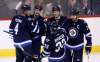 Trevor Hagan / The Canadian Press
Winnipeg Jets' Paul Postma (4), Mark Scheifele (55), Joel Armia celebrate after Armia scored against the Edmonton Oilers during pre-season NHL hockey in Winnipeg, Friday.