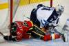 JEFF MCINTOSH / THE CANADIAN PRESS
Winnipeg Jets' goalie Ondrej Pavelec (right) is taken down by Calgary Flames' Garnet Hathaway during first period pre-season NHL hockey action in Calgary Sunday.