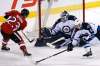 JOHN WOODS / WINNIPEG FREE PRESS
Winnipeg Jets goaltender Michael Hutchinson (34) saves the shot by Ottawa Senators' Chad Nehring (23) and Jets' Brendan Kichton (59) during first period pre-season NHL action in Winnipeg on Monday.