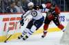 JOHN WOODS / WINNIPEG FREE PRESS
Winnipeg Jets blue-liner Dustin Byfuglien circles the cage with Ottawa’s Mark Borowiecki in hot pursuit during second-period action at the MTS Centre Monday night.