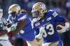 John Woods / The Canadian Press
Winnipeg Blue Bombers' Andrew Harris (33) runs against the Saskatchewan Roughriders during first half CFL Banjo Bowl action, in Winnipeg on September 10, 2016. The timing couldn't be better for Andrew Harris to return to the football field after a three-game absence. The Blue Bombers running back will suit up for the first time against his former B.C. Lions team when the clubs clash Saturday afternoon at Investors Group Field.