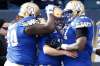 JOHN WOODS / THE CANADIAN PRESS
quarterback Matt Nichols, Travis Bond (60) and Jermarcus Hardrick (51) celebrate Nichols' touchdown against the B.C. Lions Saturday.