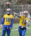 JOE BRYKSA / WINNIPEG FREE PRESS
Winnipeg Blue Bombers QB Matt Nichols (right) throws the ball next to QB teammate Bryan Bennett during practice Tuesday at the University of Manitoba soccer pitch.