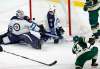 Jim Mone / The Associated Press
A shot by Minnesota Wild forward Mikael Granlund misses the net as Winnipeg Jets goalie Michael Hutchinson and defenceman Mark Stuart defend during first-period NHL action Saturday in St. Paul, Minn.