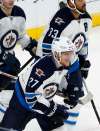JIM MONE / THE ASSOCIATED PRESS FILES
Winnipeg Jets' Nikolaj Ehlers heads to the bench after scoring against Minnesota Wild goalie Devan Dubnyk in the first period of Saturday's game in St. Paul, Minn.