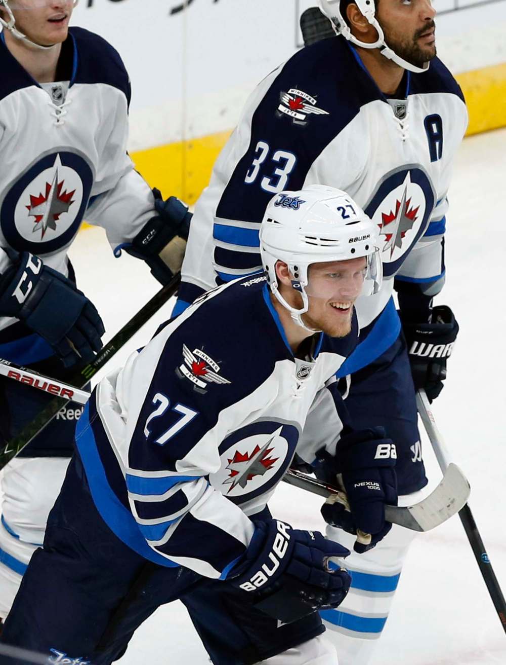 JIM MONE / THE ASSOCIATED PRESS FILES
Winnipeg Jets' Nikolaj Ehlers heads to the bench after scoring against Minnesota Wild goalie Devan Dubnyk in the first period of Saturday's game in St. Paul, Minn.