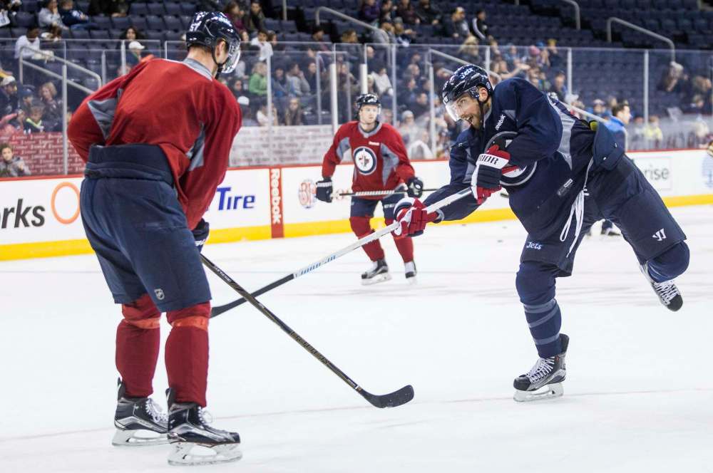 MIKE DEAL / WINNIPEG FREE PRESS Winnipeg Jets' Blake Wheeler (26) fires the puck during practice at the MTS Centre Sunday morning.