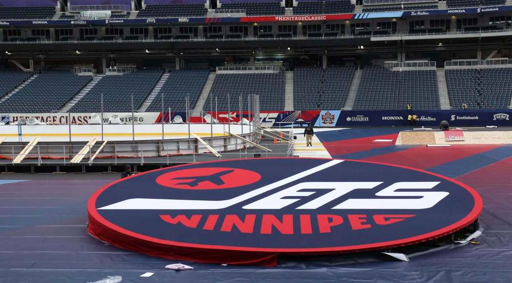 JOE BRYKSA / WINNIPEG FREE PRESS
Crews work on finishing touches for the 2016 Heritage Classic at Investors Group Field in Winnipeg Tuesday.