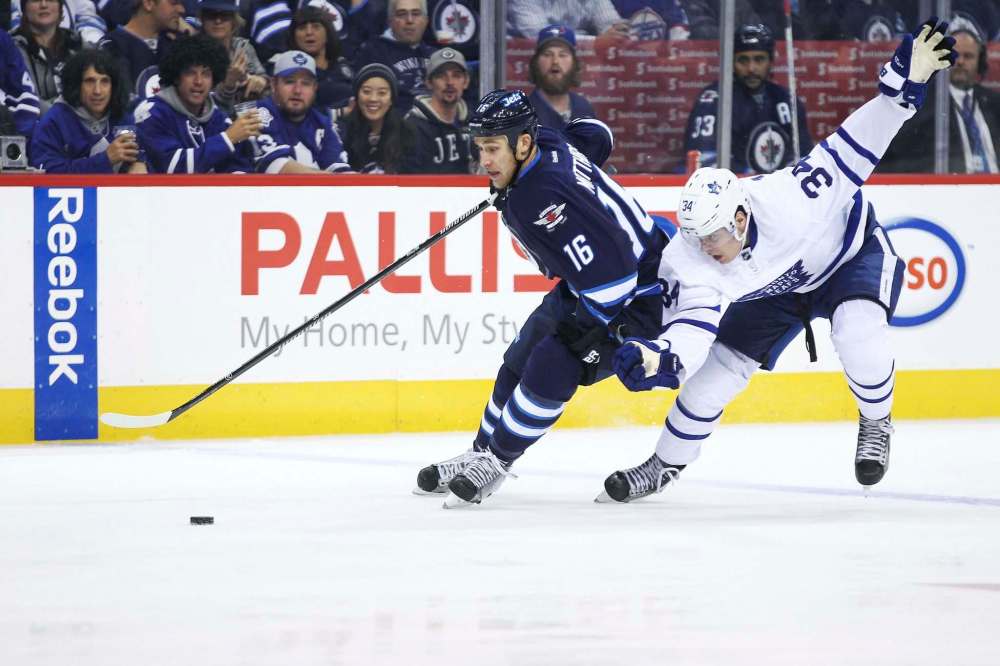 MIKE DEAL / WINNIPEG FREE PRESS
Winnipeg Jets’ Shawn Matthias (16) on a breakaway is called for holding Toronto Maple Leafs’ Auston Matthews (34) during the game at the MTS Centre Wednesday evening.
