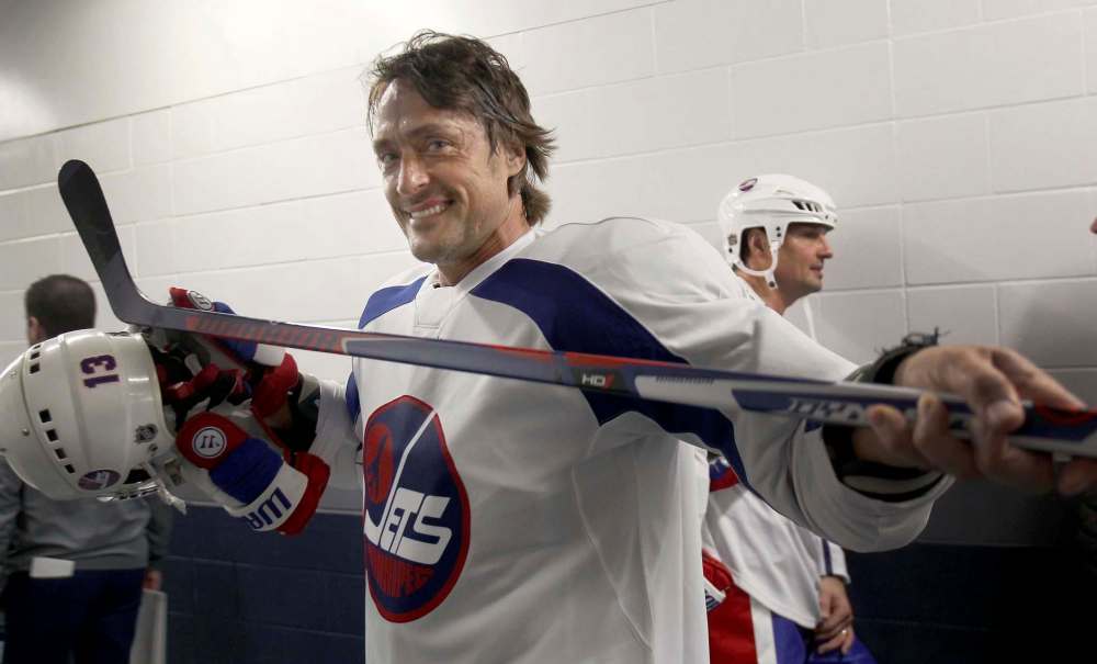 JOE BRYKSA / WINNIPEG FREE PRESS
Teemu Selanne stops to smile for a photo as he heads for the locker room after practice in the MTS Centre.