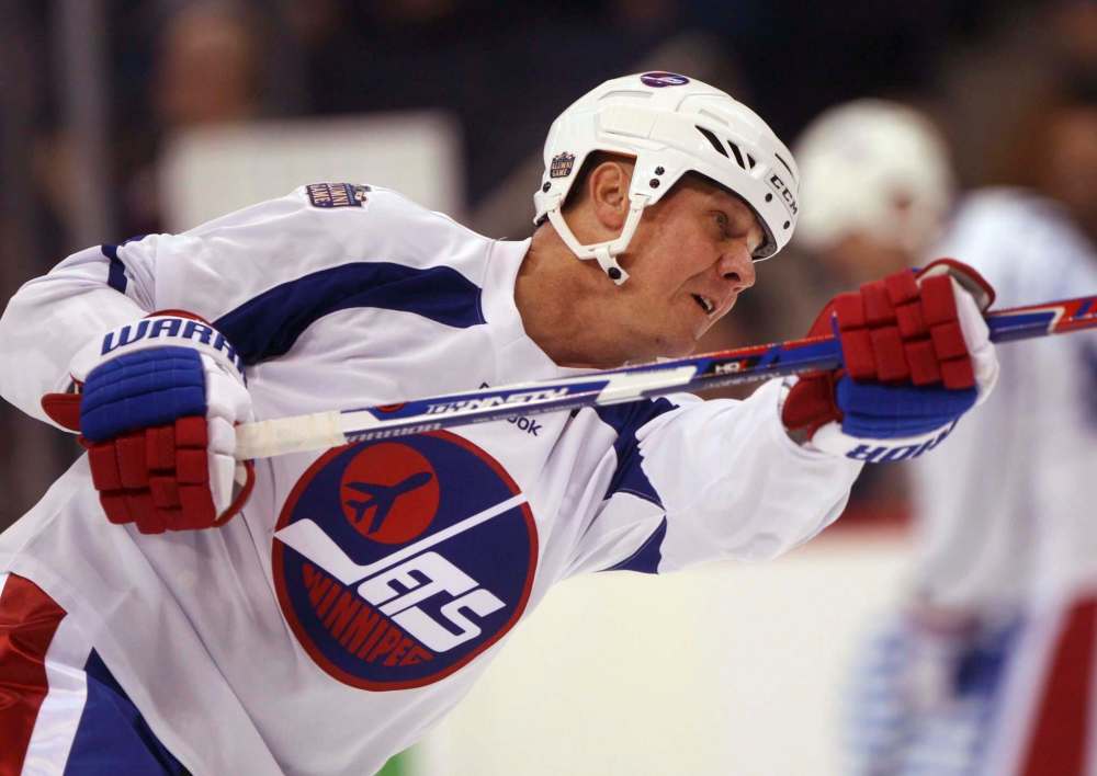 JOE BRYKSA / WINNIPEG FREE PRESS
Winnipeg Jets alumni team member Brian Mullen gets his slapper back into shape Friday at the MTS Centre.