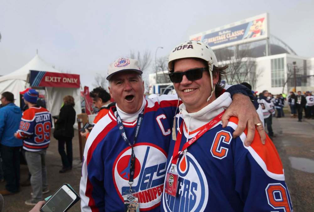 RUTH BONNEVILLE / WINNIPEG FREE PRESS
Marcy Beaucage gives his son Lee a hug prior to the alumni game after Lee bought tickets for them to attend the Saturday game.